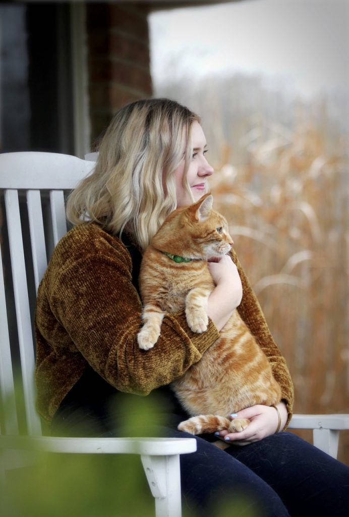 Unsplash older teen girl holding cat